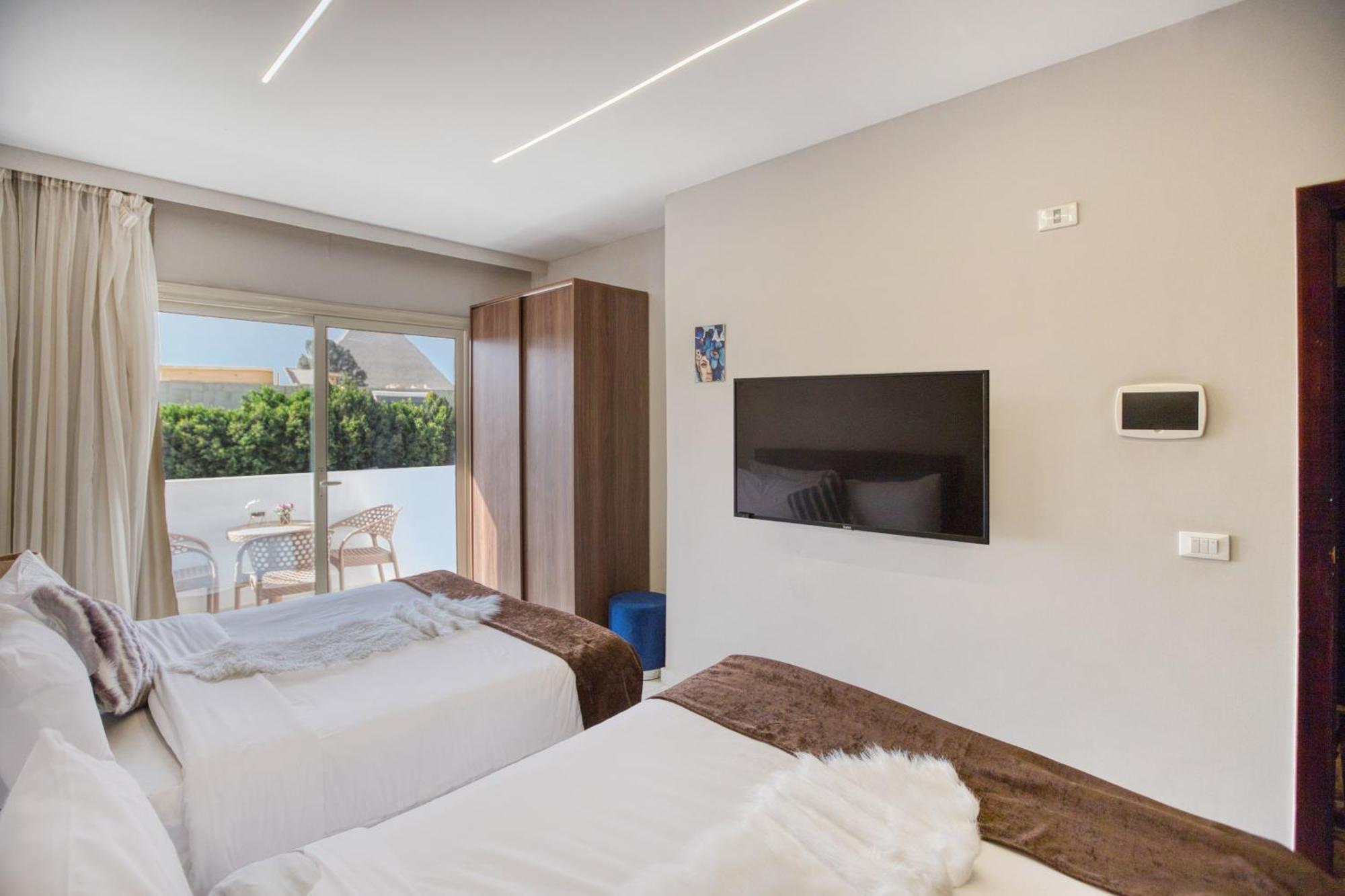 Tree Lounge Pyramids View Inn , Sphinx Giza Kafret el-Gabal 外观 照片